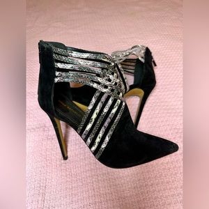 Black heels with faux snake detail